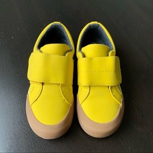 Beautiful bright yellow little boy sneakers